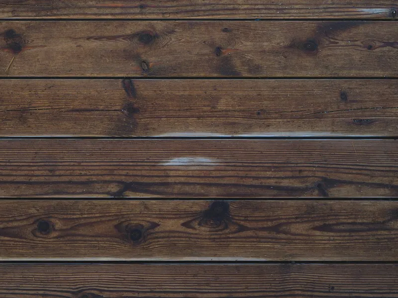 Rich brown hardwood planks showing deep grain texture and patterns